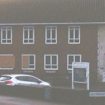 Windows at Andover Police Station were boarded up on Saturday