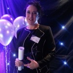 Elaine Ward poses with the Emerging Leader Award